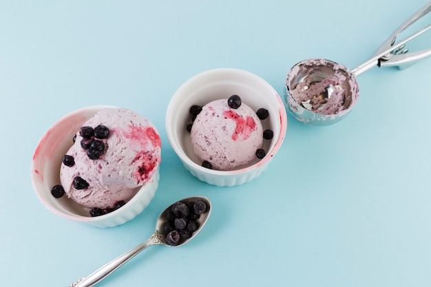 Ice cream with blueberry in white cups