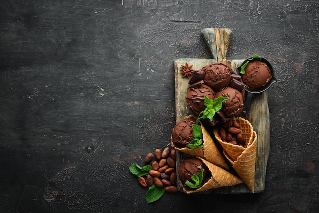 Ice cream with chocolate Making ice cream on Wooden background Top view Free space for your text