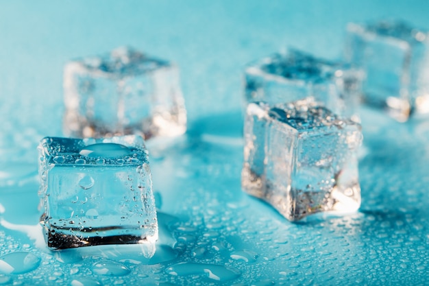 Ice cubes are scattered with water drops scattered Close up.