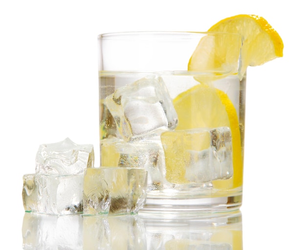 Ice cubes in glass with lemon isolated on white