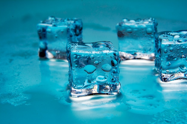 Ice cubes / Some clear melting ice cubes with drops around /close up