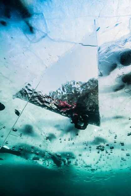 Ice diving in frozen lake