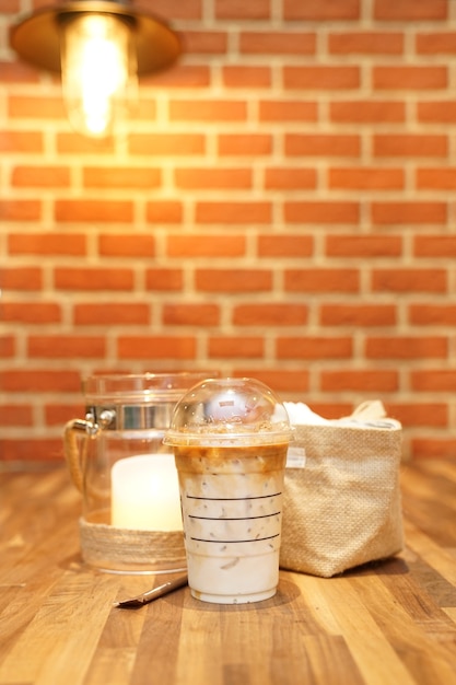 Ice latte close up show mixed milk with coffee.