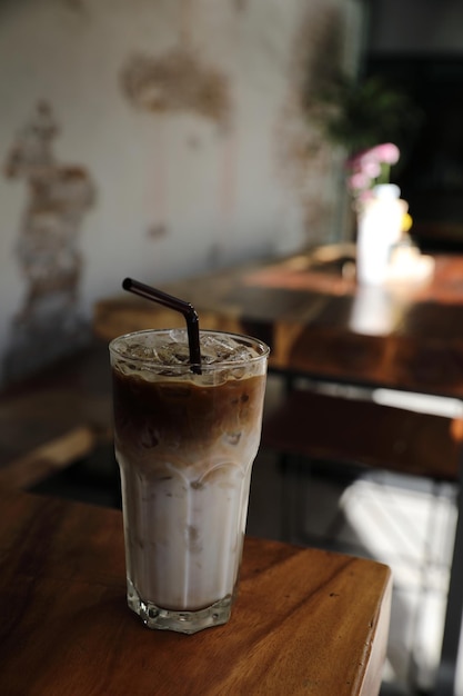 Ice latte coffe on wood in coffee shop