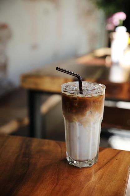 Ice latte coffe on wood in coffee shop