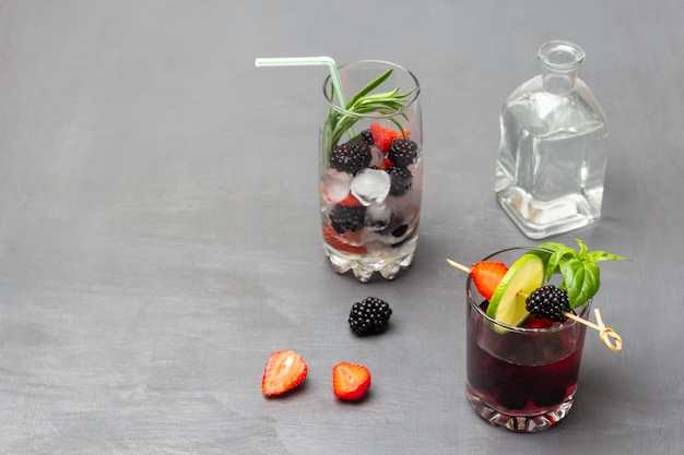 Ice rosemary and berries in glass