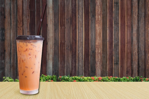 Ice Teaiced milk tea on wooden background Summer drinks with ice