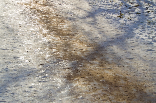 Ice track, sanded, removes ice, slippery road, close-up