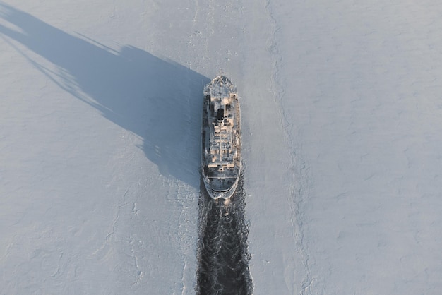 Icebreaker laying a route in the ice fields of the Arctic