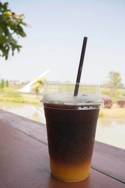 Iced americano coffee with fresh orange juice drink, stock photo