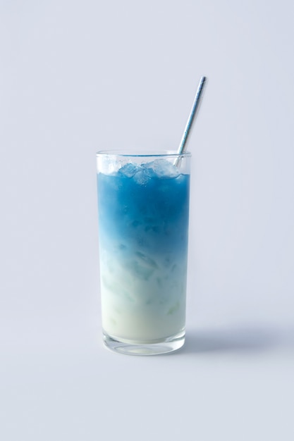 Iced blue butterfly pea latte. Healthy thai traditional cocktail drink with milk and ice