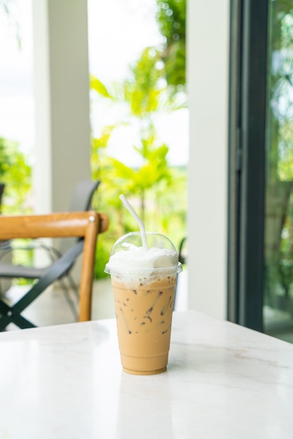 Iced cappuccino coffee glass on table