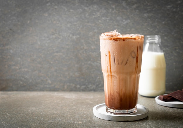 Iced chocolate milkshake drink on wood background