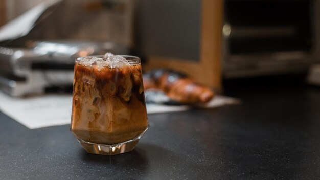 Iced coffee with milk  served on the black table at a cafe