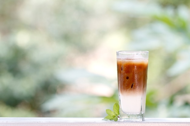 Iced coffee with milkshake, Summer refreshment drinks on wooden table in coffee shop