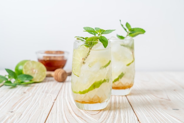 iced honey and lime soda with mint - refreshing drink