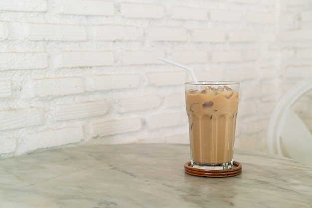 iced latte coffee glass on table in coffee shop cafe