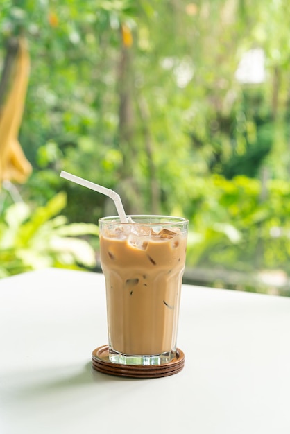 iced latte coffee glass on table in coffee shop cafe