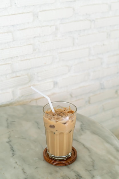 Iced latte coffee glass on table