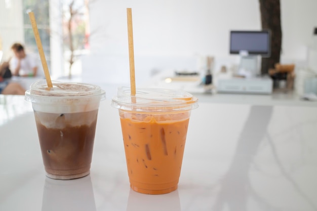 Iced milk drinks in white coffee shop, stock photo