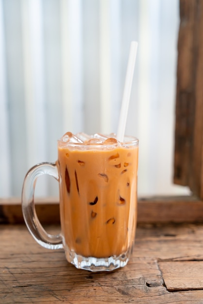 iced Thai milk tea glass in cafe restaurant