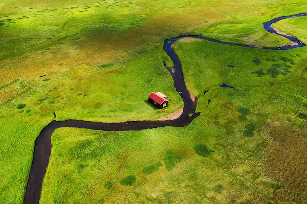 Iceland Aerial view on the alone house field and river Landscape in the Iceland at the day time Landscape from drone Travel image