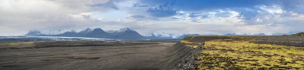 Iceland autumn tundra landscape near Haoldukvisl glacier Iceland Glacier tongue slides from the Vatnajokull icecap or Vatna Glacier near subglacial Esjufjoll volcano Not far from Iceland Ring Road