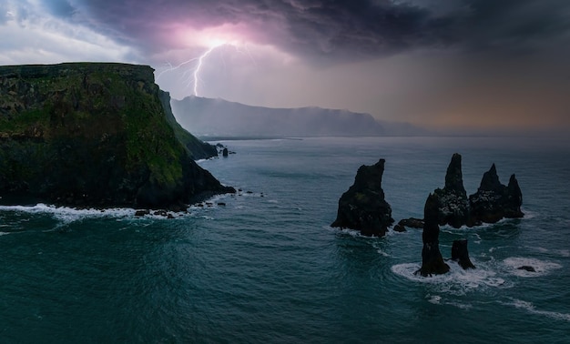 Iceland black sand beach with huge waves at reynisfjara vik