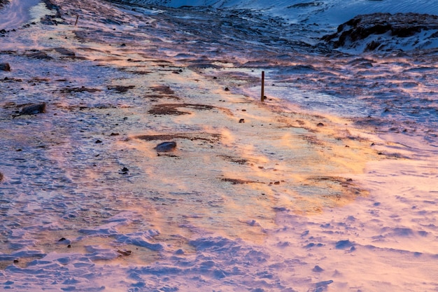 Iceland. Reykjadalur steam valley near Reykjavik, in Iceland with hills covered in white during winter