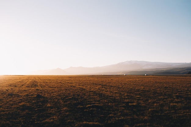 Iceland Sunset Landscape in the dunes at the south of the island with hills at the background