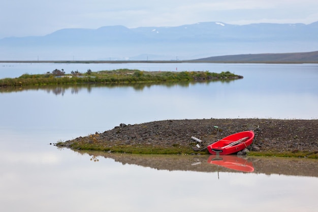 Iceland Water Landscape with Red Boat