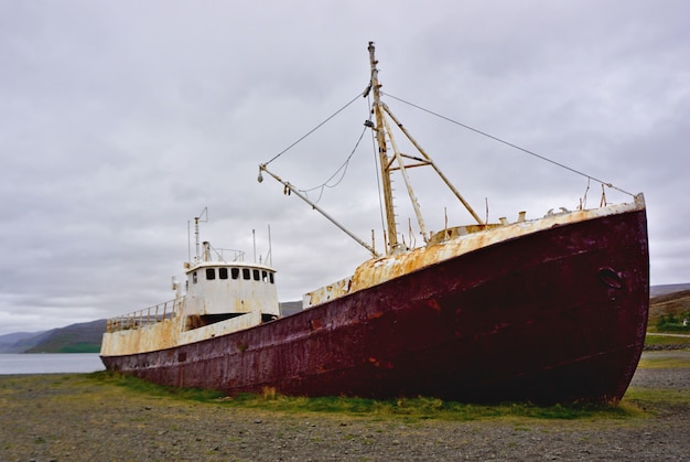 Iceland west fjords, Patreksfjordur. Old shipwreck in the Westfjords. Abandoned rusty ship wreck in a bay in north west Iceland.