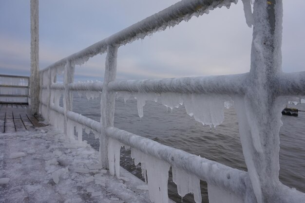 Icicles hanging on footbridge frost winter concept