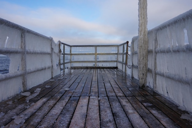 Icicles hanging on footbridge frost winter concept