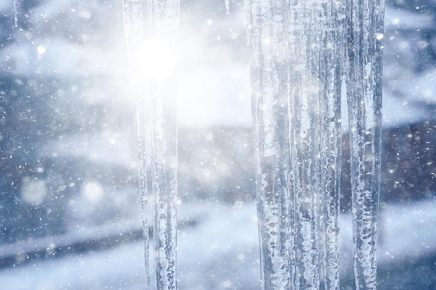 icicles on the roof urban background view winter city