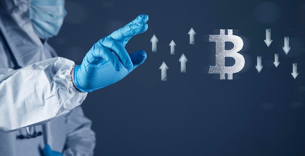 Icon of bitcoin and arrows up and down from the network The doctor clicks on the screen