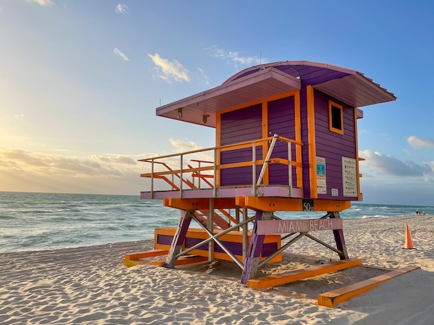 Iconic purple lifeguard house in Miami Beach Beautiful sky at sunrise