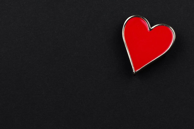 Icons in the shape of hearts lie on a black background