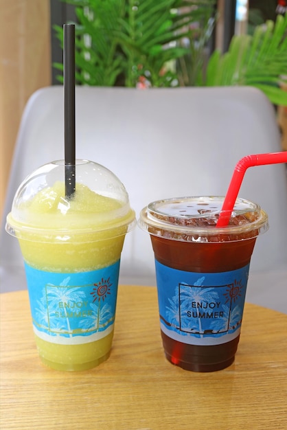 Icy sugarcane frappe and Iced coffee in takeaway plastic cups