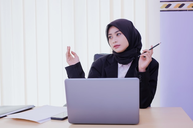 Ideas for business thoughtful young woman in the office