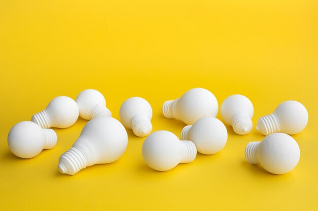 Ideas inspiration concepts with group of lightbulb on pastel color