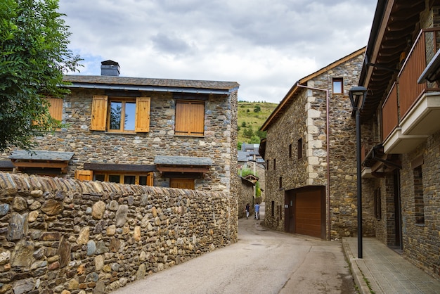 Idyllic street with buildings with stone walls in Llivia Catalonia Spain