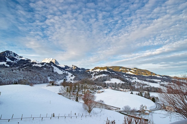 Idyllic winter landscape of Swiss mountains. Region of Gruyere, province of Fribourg, Switzerland