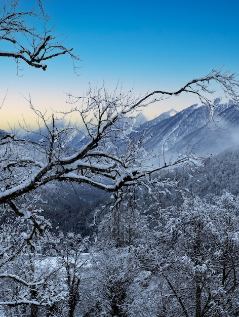 Idyllic winter mountain landscape in Alps Winter mountain landscape at sunrise Snow Mountain with Blue Sky