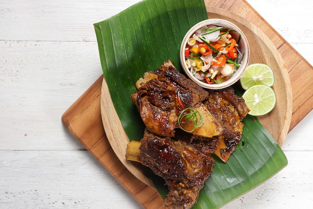 Iga Bakar Madu sambal matah or Honey Roasted Ribs served with traditional balinesse sauce