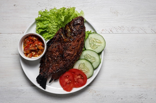 Ikan Nila Bakar sambal bawang indonesian traditional grilled nille tilapia fish with chilli garlic