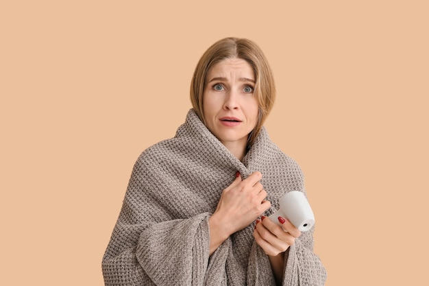 ill woman with infrared thermometer