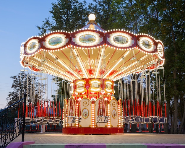 Illuminated carousel in amusement park