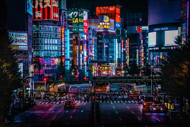 Illuminated city street and buildings at night