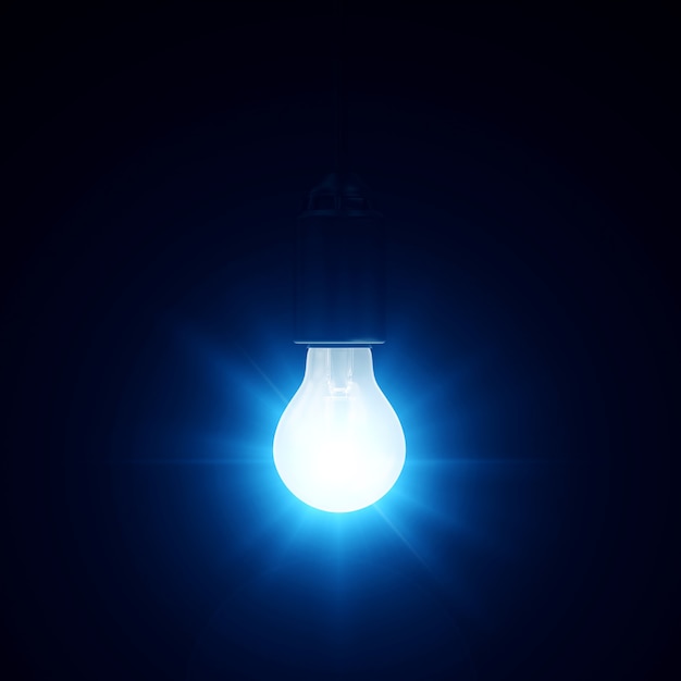 Illuminated Hanging Light Bulb on blue dark background